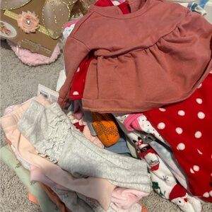 Lot of newborn girls clothing. Pants, onesies, shorts, and sleepers